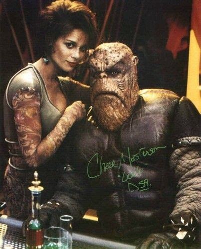 an image of a man and woman in the movie creature with ink on their arms