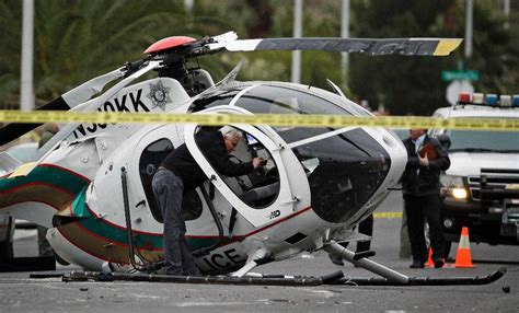 2 officers hurt in police helicopter crash on residential street northeast of downtown Vegas ...