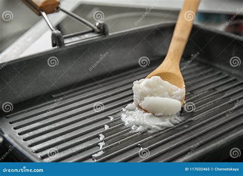 Wooden Spoon with Coconut Oil in Frying Pan Stock Image - Image of ...