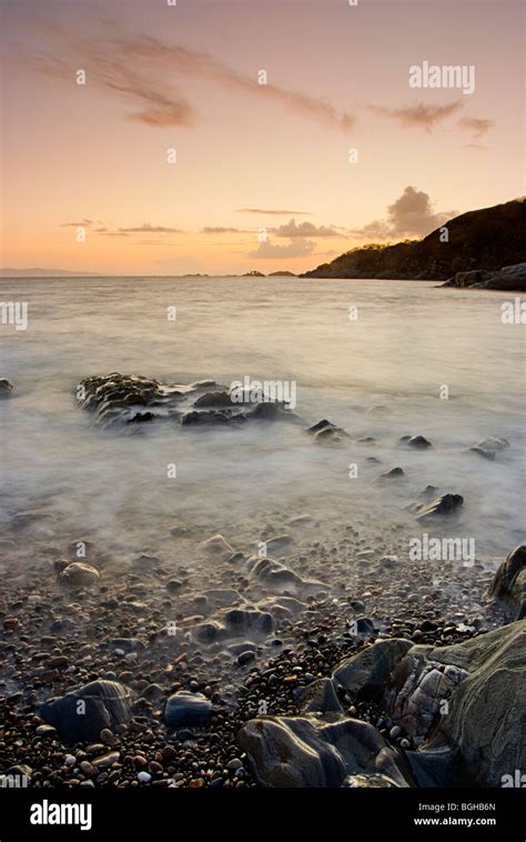 A stunning beach on a Scottish loch shot at sunset using a very long ...