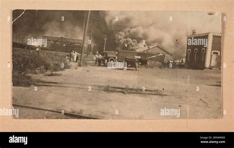 Photograph of the Greenwood District burning during the Tulsa Race Massacre 1921 Stock Photo - Alamy