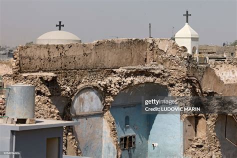 A picture shows a view of a damaged church in the old city of Mosul ...