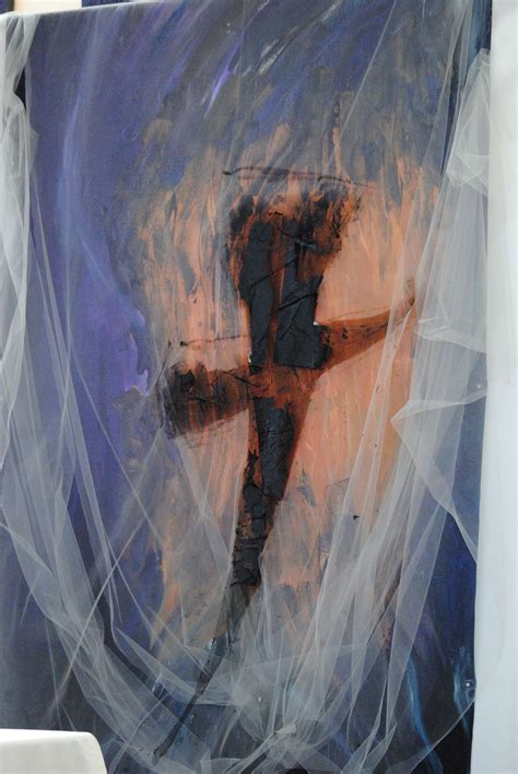 an artistic painting is wrapped in plastic to look like a cross