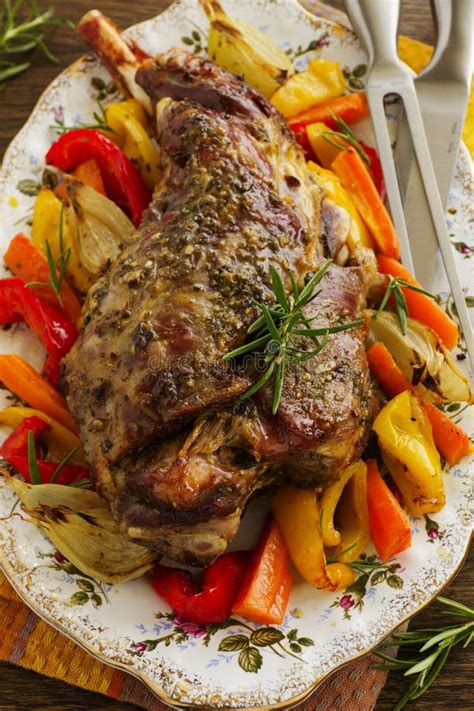 Roast Leg of Lamb with Rosemary and Garlic Stock Photo - Image of traditional, board: 51055030