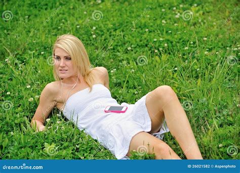 Beautiful Young Woman Laying in Grass - Music Stock Photo - Image of grass, park: 26021582