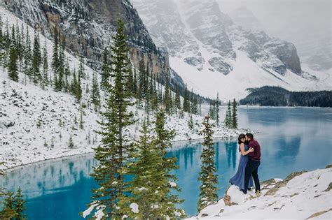 Moraine Lake in October: Freshly frozen mountain lake with blue ice stunning backdrop for ...