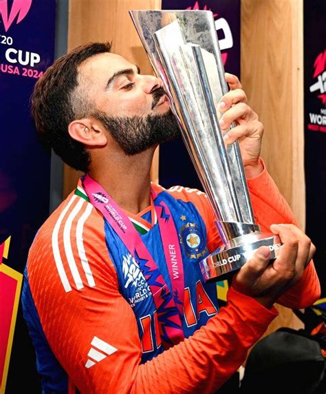 Barbados : India's Virat Kohli poses with trophy after the team's victory in the ICC Men's T20 ...