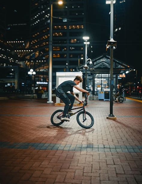 Man Riding Bicycle during Nightfall · Free Stock Photo