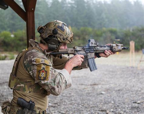 A Canadian Special Operations Regiment (CSOR) soldier fires his C8 Carbine during a shooting ...