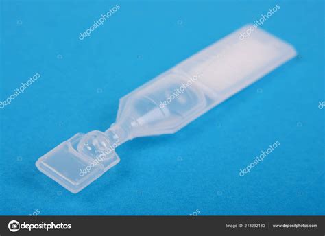 Artificial Tears Dry Eyes Isolated Blue Background Stock Photo by ©amphoto 218232180