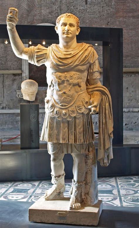 a statue of a roman soldier with his arm in the air and holding a ...