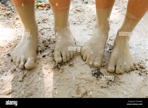 Feet in mud close-up Stock Photo - Alamy