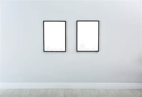 Frames with Empty Canvases on Wall in Modern Art Gallery. Stock Photo ...