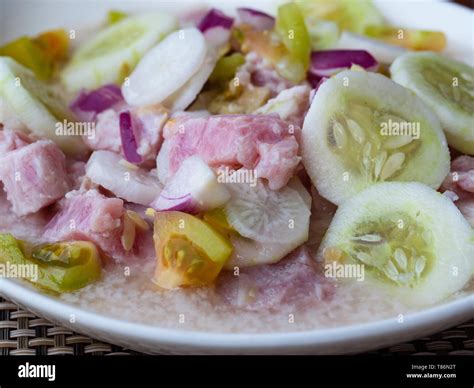 Kinilaw na tuna, a traditional Filipino dish. Kinilaw is prepared with raw tuna or other fish by ...