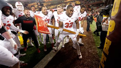 Wisconsin football vs Minnesota rivalry through years playing for Axe