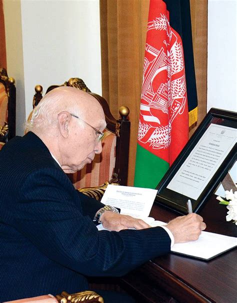 Sartaj Aziz signs condolence book at Afghan Embassy