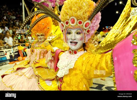 Carnival in Argentina. Members of one group of carnival dance and interpret during their ...