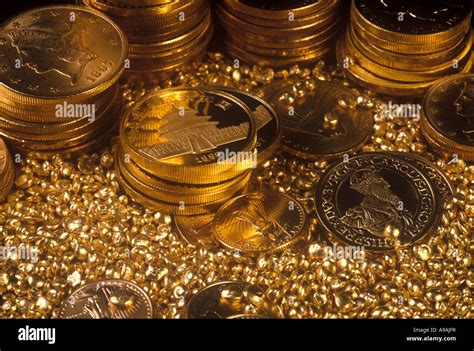 BACKGROUND OF INTERNATIONAL GOLD BULLION COIN STACKS IN GOLD SHOT Stock ...