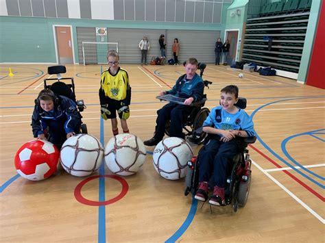 Football For All Participants Smiling and Showing Their Adapted Equipment - Grampian Disability ...