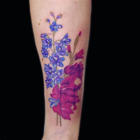 Larkspur Tattoo Ideas for Delicate Beauty and Spiritual Significance