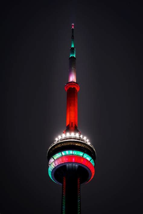 Modern illuminated tower on night sky · Free Stock Photo