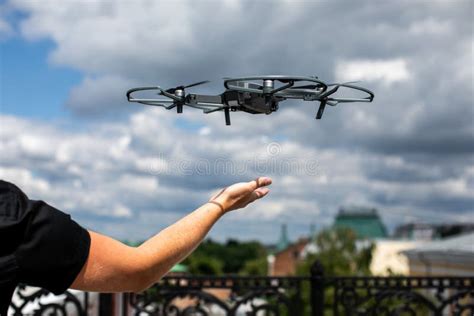 Drone Landing on Hand. Drone and Photographer Man Hands.drone Copter ...