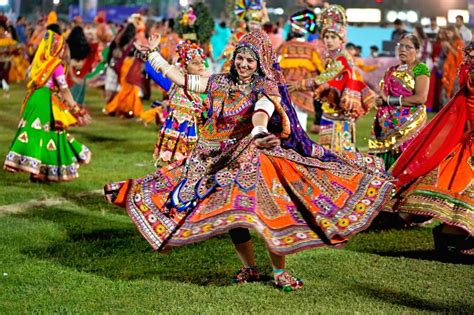 : Ahmedabad: Women wearing traditional costumes perform 'Garba