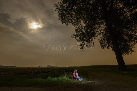 Young Girl Sitting Alone in the Dark Stock Image - Image of girl ...