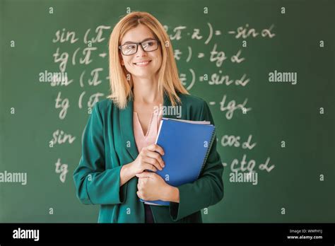 Beautiful math teacher in classroom Stock Photo - Alamy