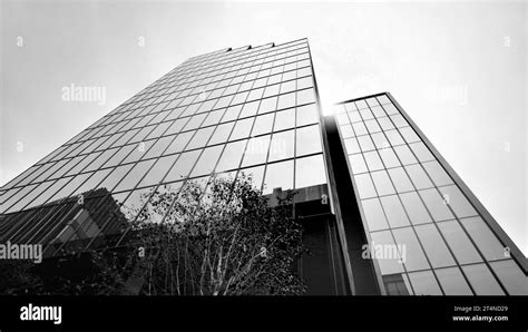 Abstract reflection of modern city glass facades. Modern office building detail, glass surface ...