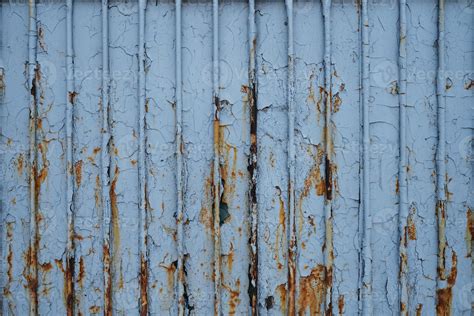 Old rusty metal fence, covered in paint and debris, frontal photo ...