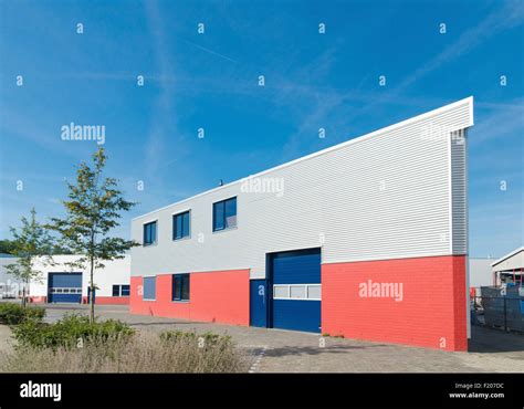 exterior of a modern warehouse building with office Stock Photo - Alamy