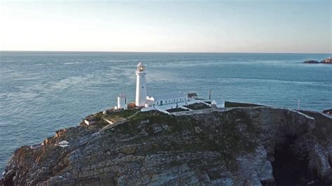 Aerial View of South Stack with Lighthouse During Sunset, Stock Footage