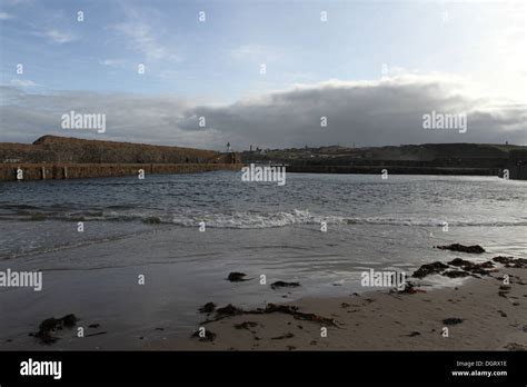 Entrance to Banff harbour with Macduff waterfront Scotland October 2013 ...