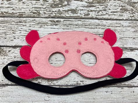 "These embroidered felt AXOLOTL masks inspire creative play and are the ...