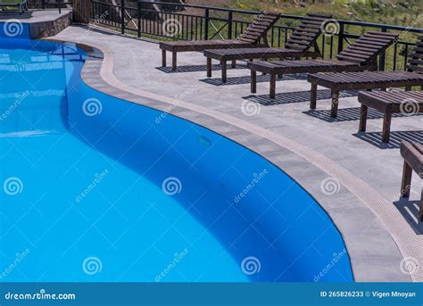 Swimming Pool on the Background of Blue Water . Stock Image - Image of ...