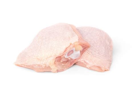 Premium Photo | Raw chicken thighs isolated on white