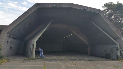 a person standing in front of a large building