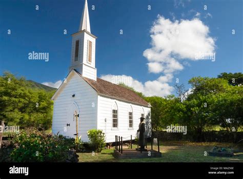 A statue of Father Damien outside St. Damien Church Molokai, Hawaii ...