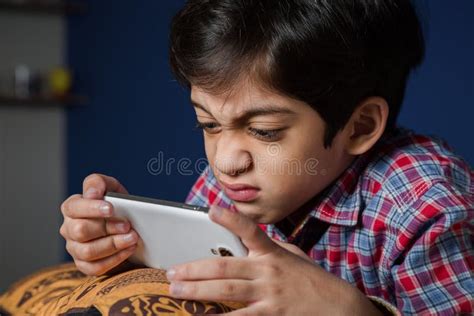 Child Using a Smart-phone with Funny Expression. Stock Image - Image of morning, adorable: 63968259