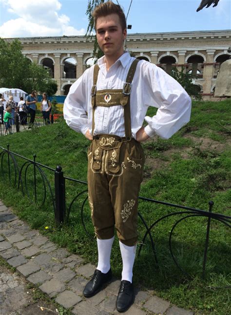 Traditional Bavarian (Germany) folk dress: dirndl dress and lederhosen ...