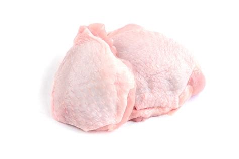 Premium Photo | Raw chicken thigh isolated on white background.