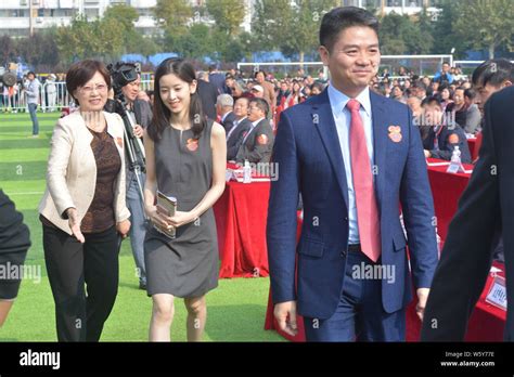 --FILE--Richard Liu Qiangdong, right, Chairman and CEO of JD.com, and his wife Zhang Zetian ...