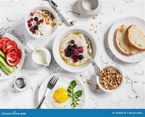 Assortment of Breakfast - Oatmeal with Berries, Fried Egg, Fresh ...