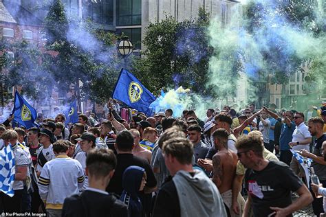 Leeds United fans celebrate Premier League promotion at non-socially distant street party ...