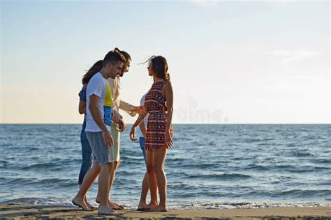 Friends Fun on the Beach Under Sunset Sunlight. Stock Photo - Image of lifestyles, group: 109636984