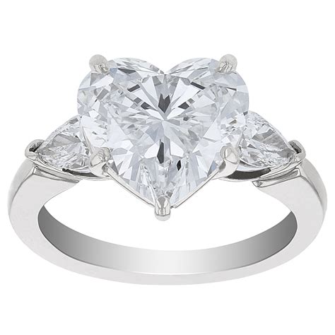 Heart Shaped Diamond Ring with Pear Shaped Diamond Sides in Platinum ...