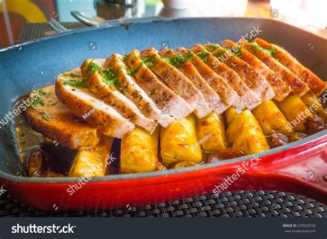 Hawaiian Kurobuta Pork chop , baked pineapple .Lighting with sun flare. Delicious Slow Cooker ...