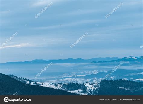 Scenic View Snowy Mountains Pine Trees Cloudy Sky — Stock Photo ...