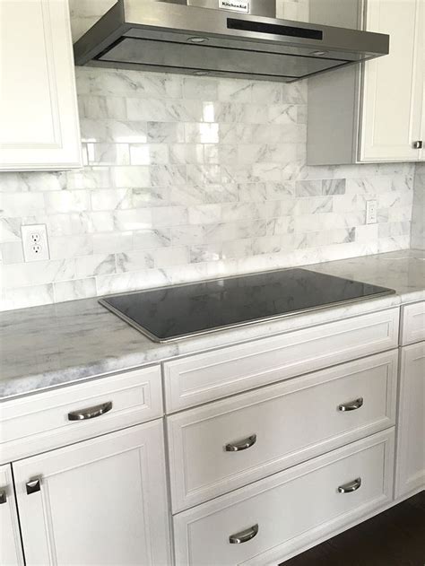 Carrera Marble Subway Tile Backsplash with white cabinets | Kitchen Ideas | Kitchen marble, New ...